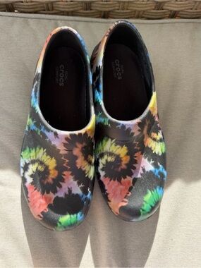 CROCS Tie-Dye Floral Slip-On Clogs in Multicolor and Black